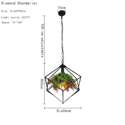 Black metal industrial greenery chandelier with geometric diamond frame housing green and orange foliage decorbites industrial