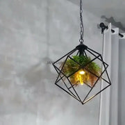 Black metal geometric pendant light with hanging chain and greenery inside by Decorbites industrial greenery chandelier