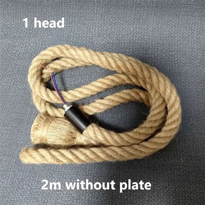 Beige braided hemp rope pendant light with black cylindrical head and exposed wires for living room decorbites hemp rope decor