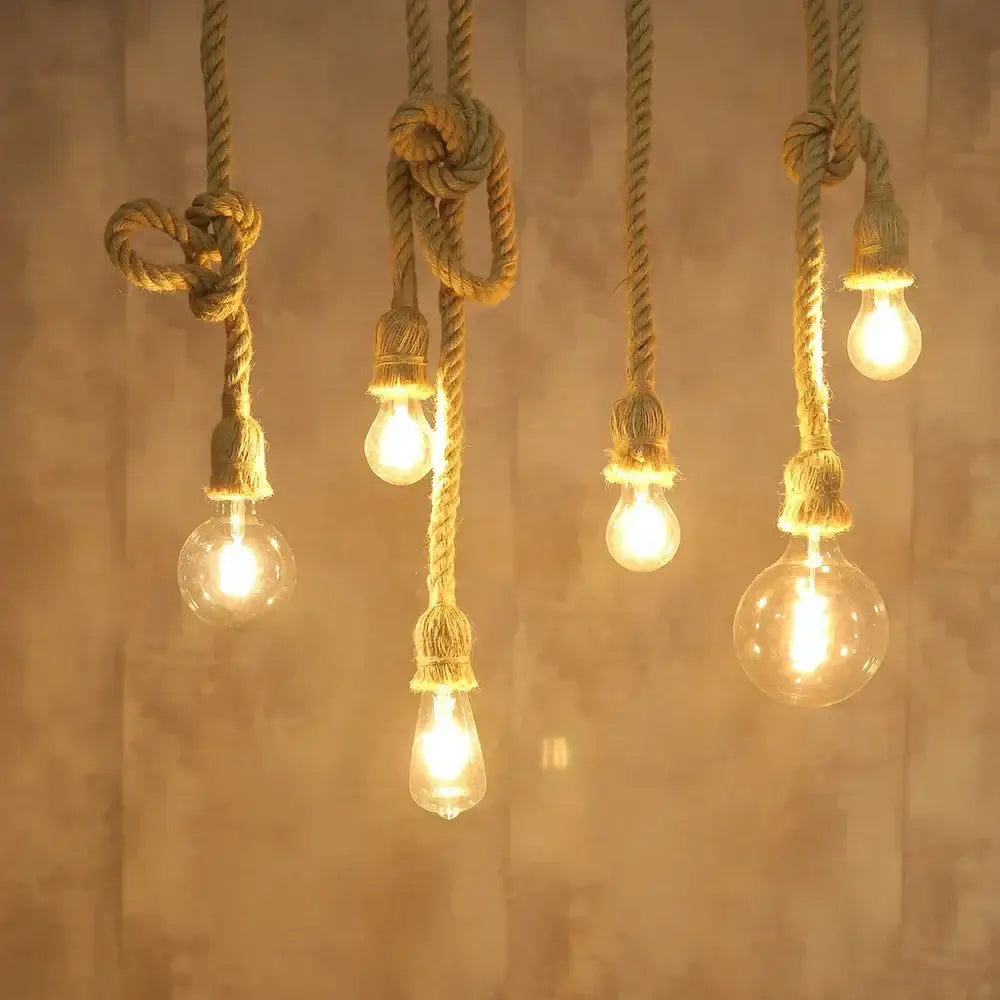 Industrial hemp rope pendant lights with natural twisted rope cords and warm glowing glass bulbs for living room decorbites decor