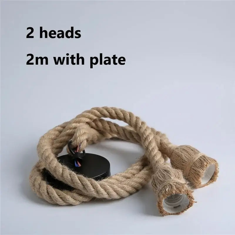 Industrial hemp rope pendant light with natural fiber rope, two exposed bulb sockets, and black mounting plate for decorbites pendant lights