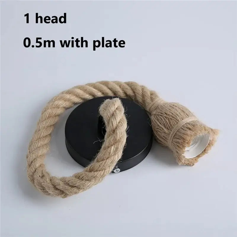 A rustic industrial hemp rope pendant light with natural jute cord and black circular plate for living room decorbites decor