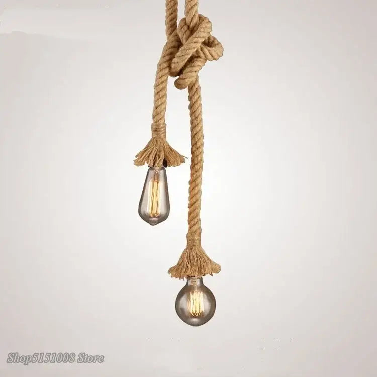 Industrial hemp rope pendant light with two exposed filament bulbs hanging from a knotted natural-colored rope decorbites pendant lights
