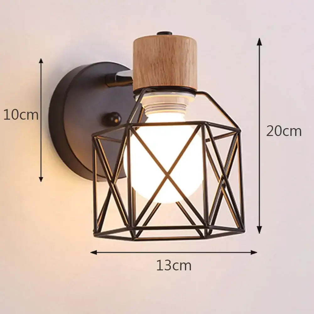 Black metal iron cage wall light with natural wood top and exposed bulb perfect for bedroom decorbites iron cage