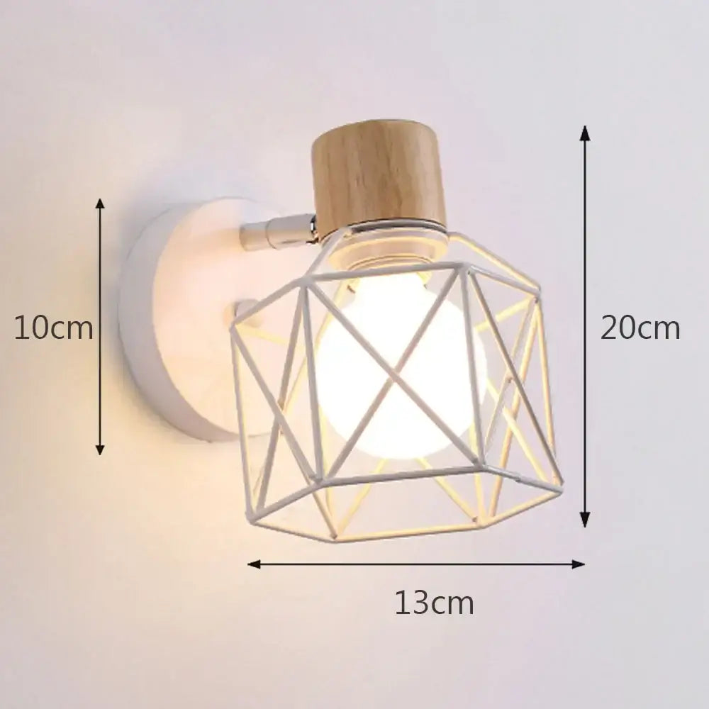 A modern industrial iron cage wall light with a silver metal frame, white base, and natural wood cap by decorbites