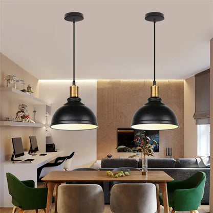 Black industrial iron dome pendant light with brass accents hanging above dining table for kitchen cafe decorbites iron dome