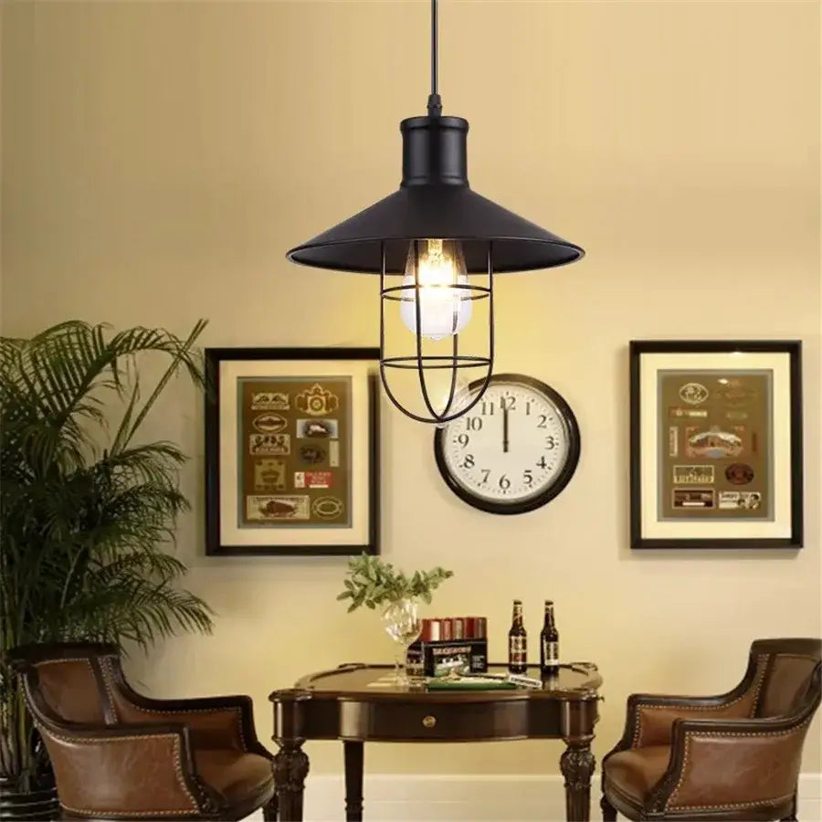 Black metal pendant light with cage-style design and exposed bulb for industrial iron dome kitchen cafe decorbites decorbites iron dome industrial