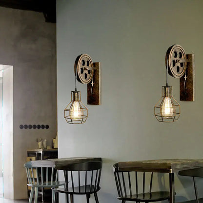 Industrial iron wall sconce with brass gear backplate wire cage and wooden pulley for cafe decorbites industrial iron decor