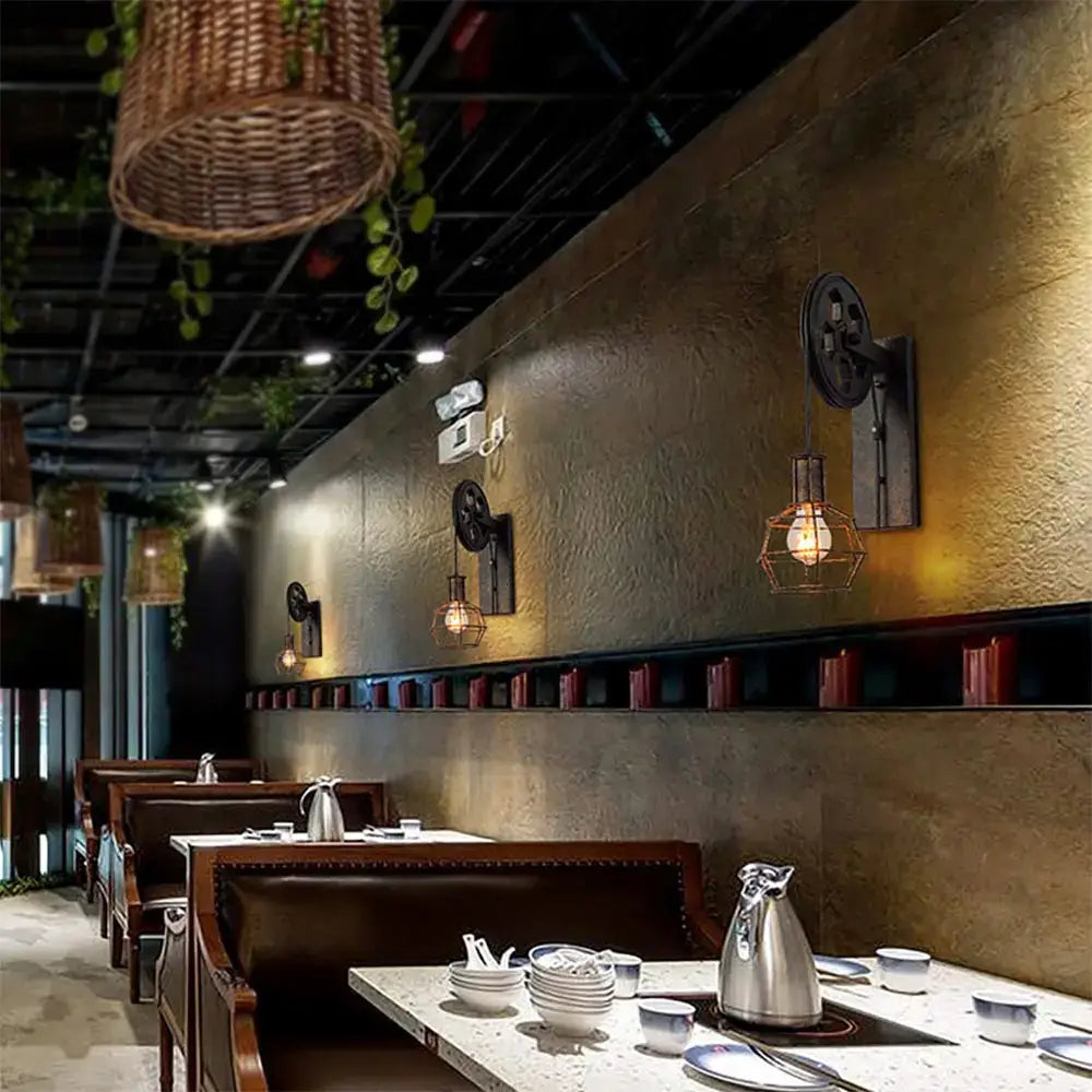 Industrial iron wall sconce with black metal gear fixture wooden pulley and hexagonal wire cage for cafe decorbites decor