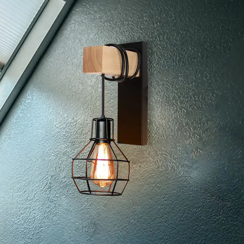 Industrial iron wall sconce with black metal cage and wooden pulley for cafe decor by decorbites industrial iron