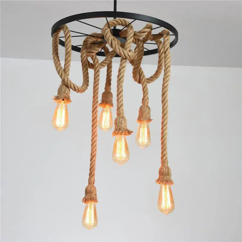 Industrial loft chandelier featuring thick natural-brown rope and black metal frame with glowing edison bulbs by decorbites industrial