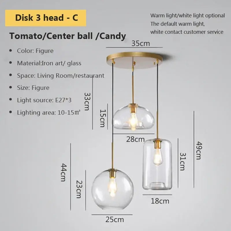 Modern industrial loft glass pendant light featuring three clear glass globes with brass-toned iron fixtures for dining room decorbites