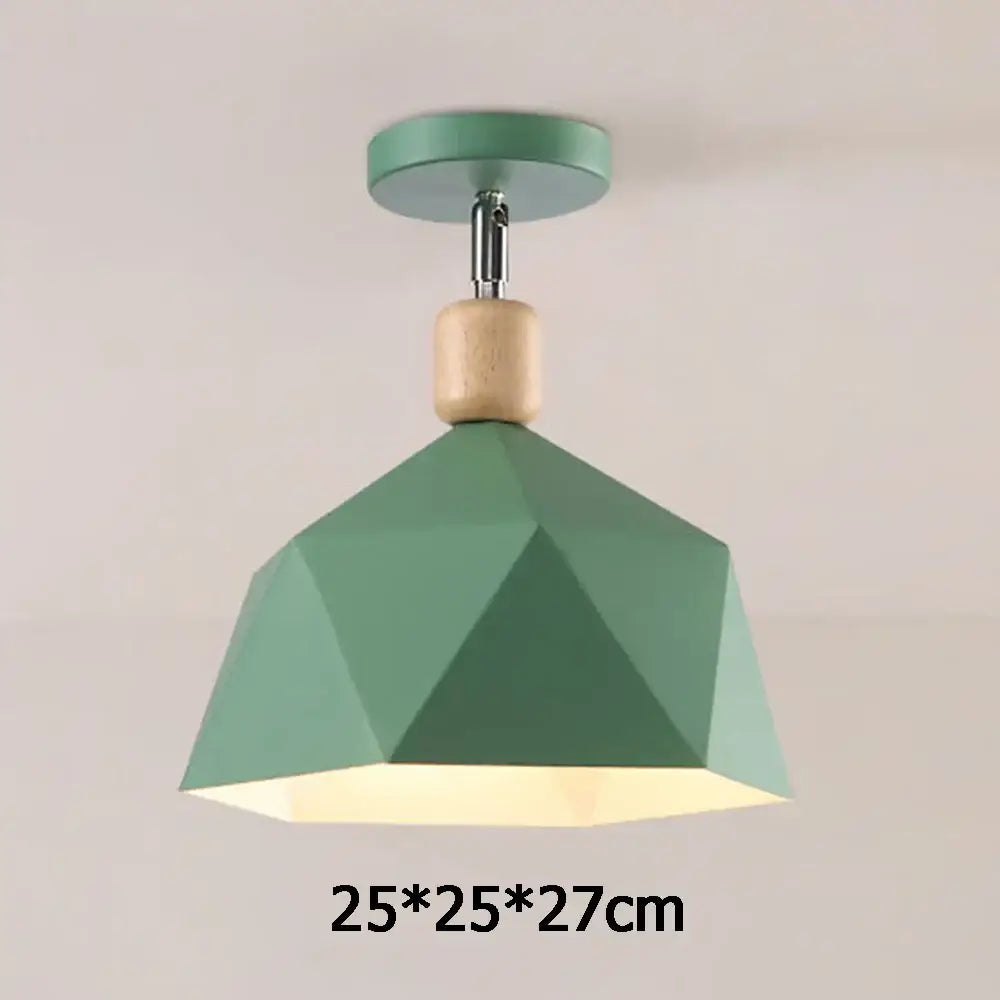 A modern sage green pendant light with faceted shade and wood accent for decorbites industrial loft ceiling decor