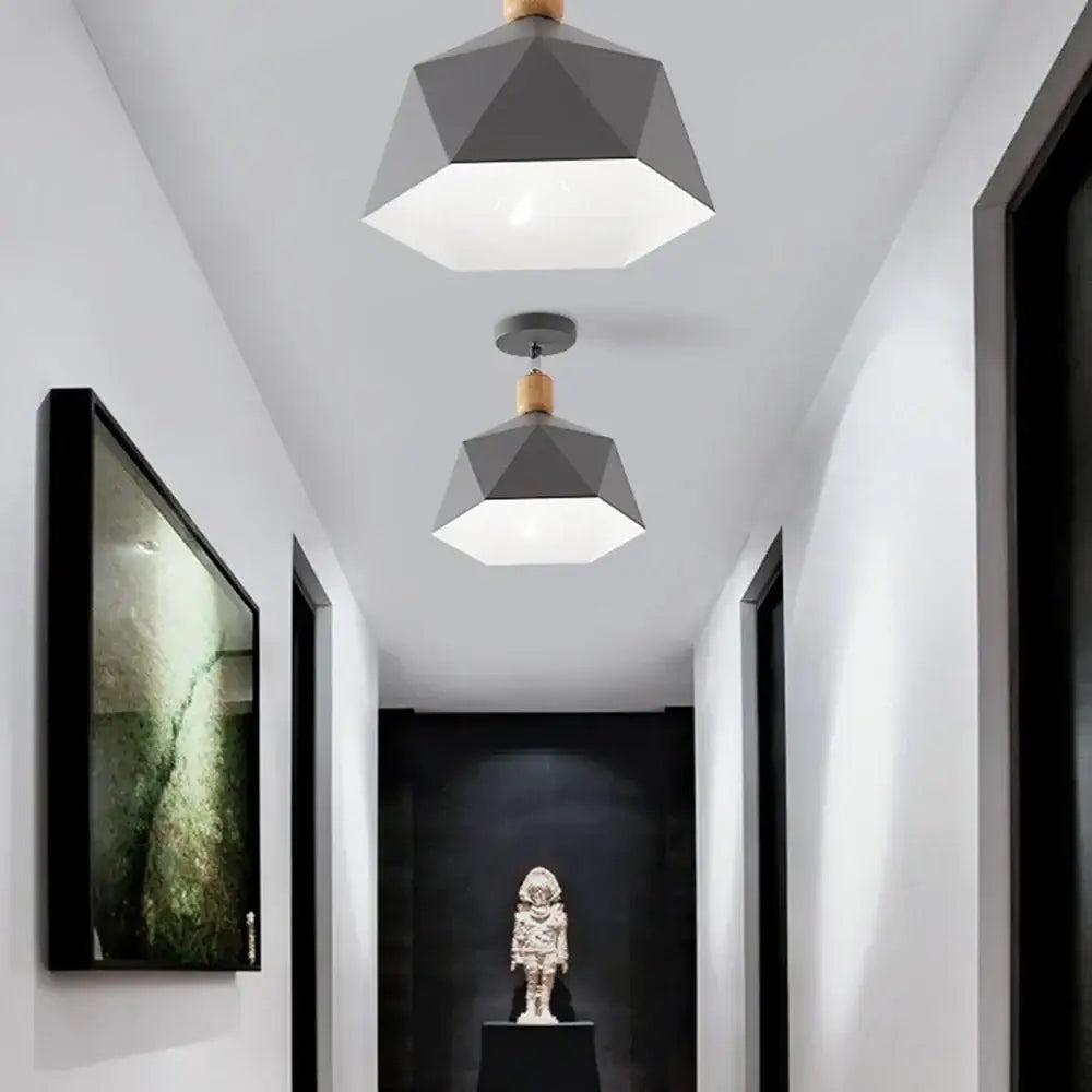 Geometric gray pendant light with wooden accents hanging from ceiling in decorbites industrial loft ceiling kitchen lamp