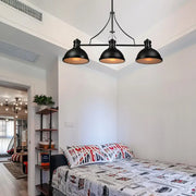 Decorbites™ retro island lighting featuring a black industrial pendant light with three dome shade fixtures and glass diffusers