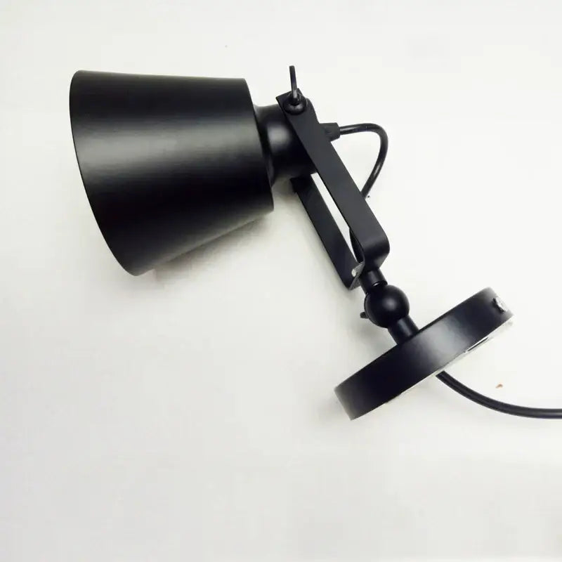 Black matte-finished industrial wall light with adjustable edison wall arm and conical shade for bedroom sconce decorbites