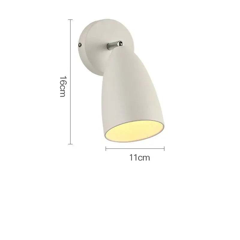 A sleek off-white wall lamp with matte finish and an adjustable swing long arm for bedroom decorbites lighting