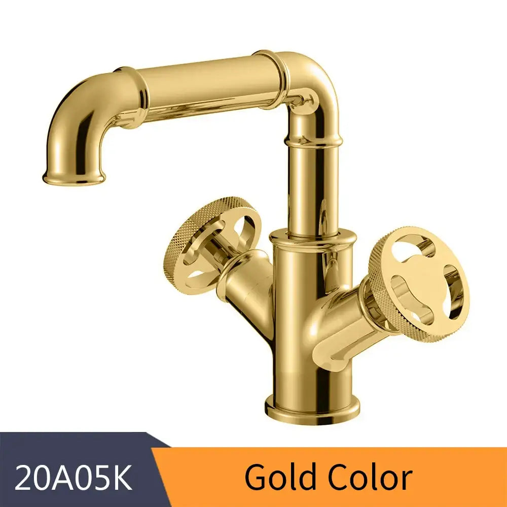 Gold-colored brass bathroom faucet with vintage industrial design and ornate wheel handles for decorbites black brass decor