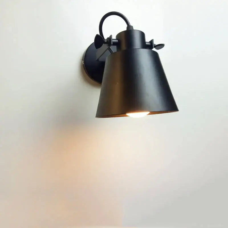 Black metal wall light with conical shade and adjustable arm in industrial matte black iron loft edison style for bedroom use
