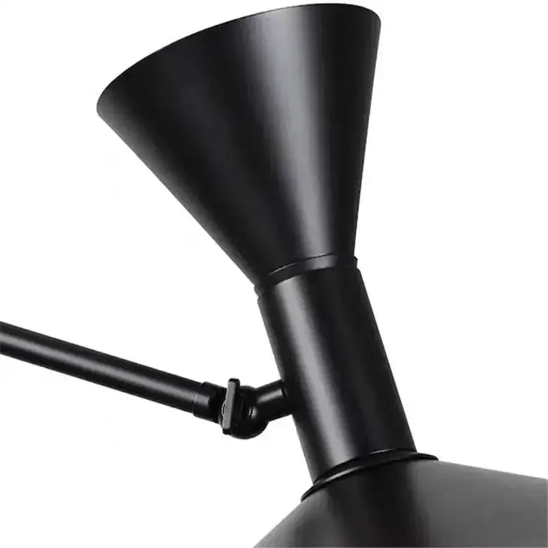 Industrial matte black rotatable wall sconce lamp with conical shade and articulated arm for bedroom lighting