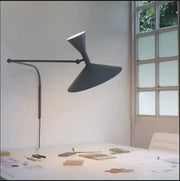 Modern matte black adjustable wall sconce lamp with a sleek sculptural design for industrial bedroom use