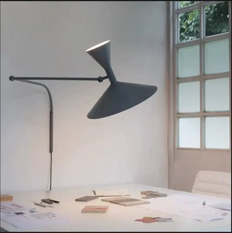 Modern matte black adjustable wall sconce lamp with a sleek sculptural design for industrial bedroom use