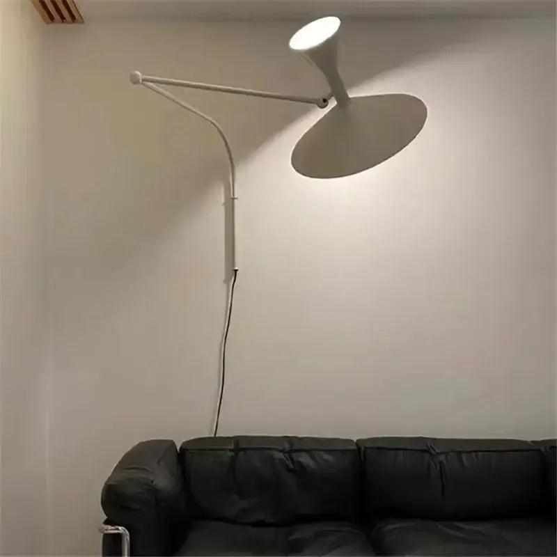 White wall sconce lamp with curved arm and conical shade designed as an industrial matte black rotatable wall sconce lamp