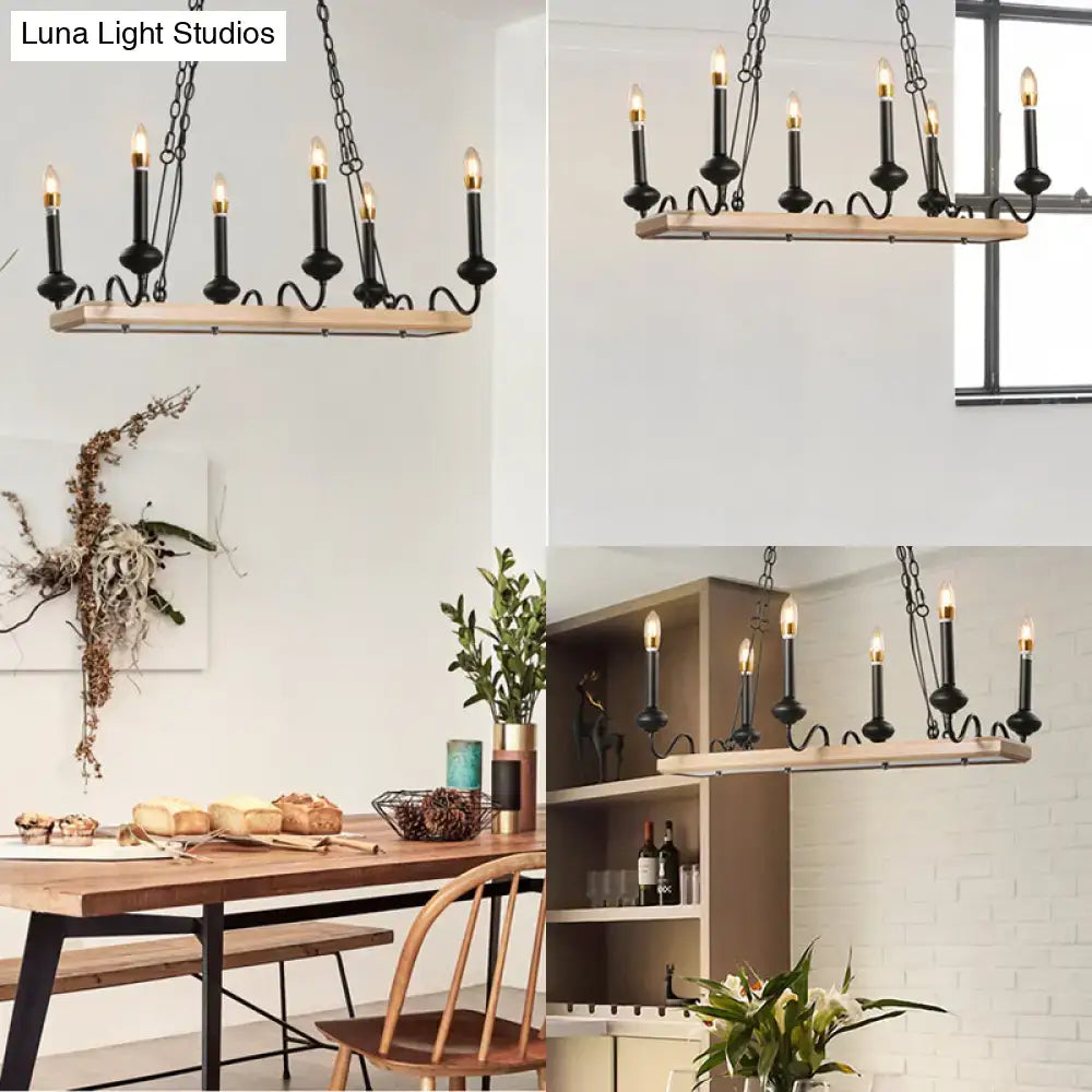 Black finish indoor island pendant light with industrial metal frame, wooden canopy, and wrought iron chains