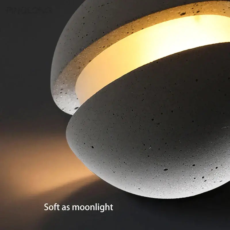 Gray concrete pendant lamp with warm glowing inner ring featuring decorbites cement chandelier design for kitchen decor