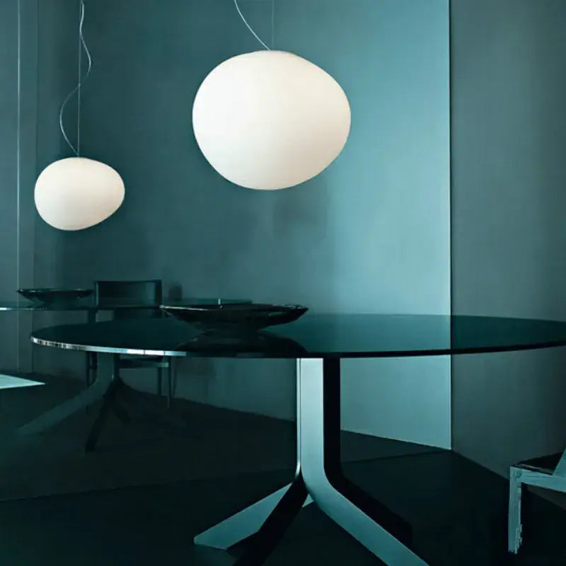 Two white spherical pendant lights hanging from ceiling as decorbites industrial living off-white oval pendant light fixture