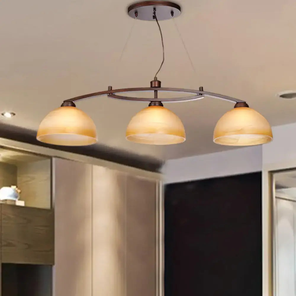 Decorbites industrial style three-light pendant fixture with amber glass shades in oil rubbed bronze finish for indoor use