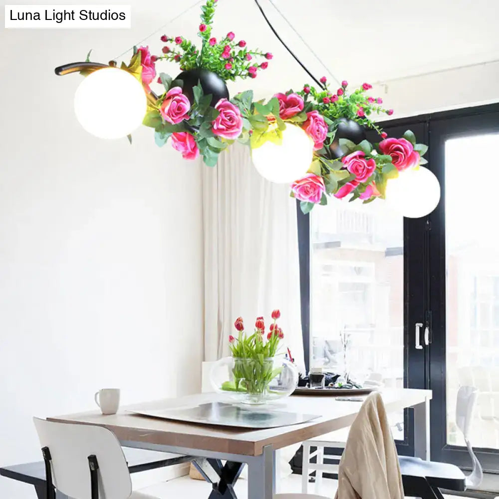 DecorBites industrial opal glass pendant light with three black flower heads and white spherical lights for dining room island