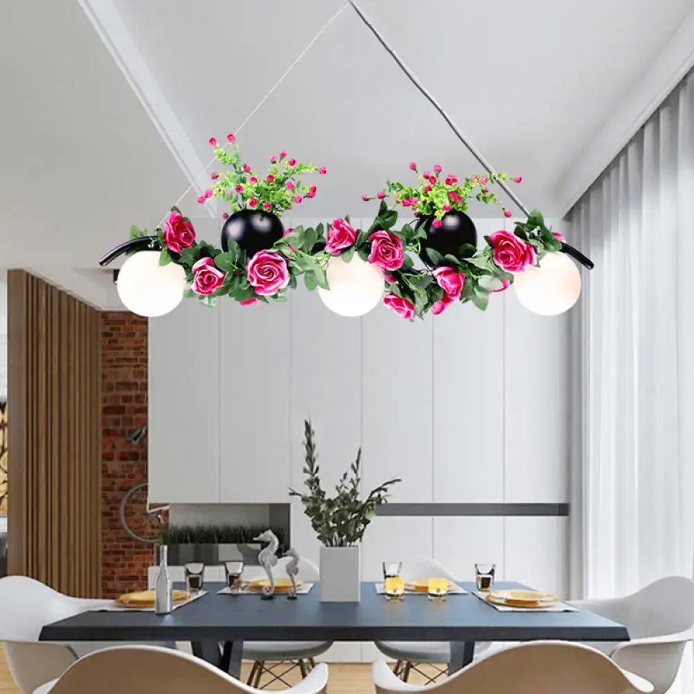 A modern decorbites industrial opal glass pendant light with three white opal bulbs and black flower heads for dining room island
