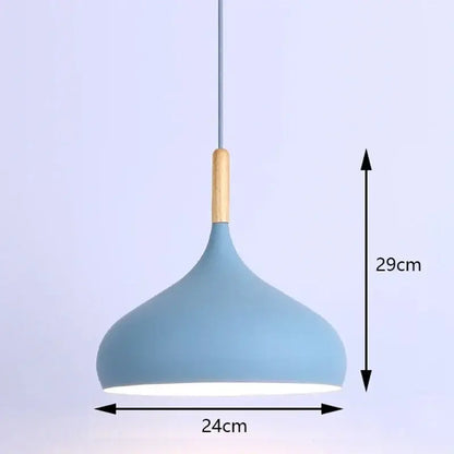 A modern industrial pendant light with a matte blue metal shade and natural wood accent for kitchen use