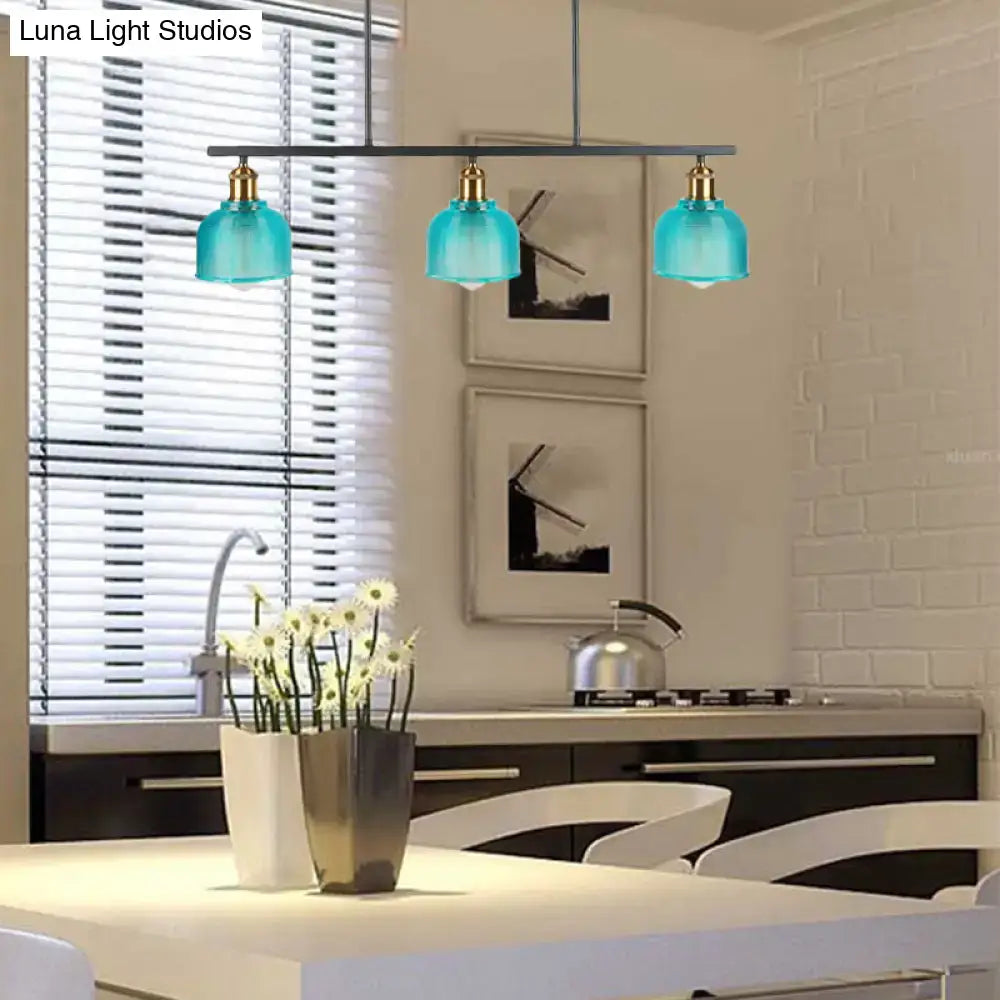 Modern turquoise glass pendant light with brass accents hanging above kitchen island for red yellow blue decorbites lighting