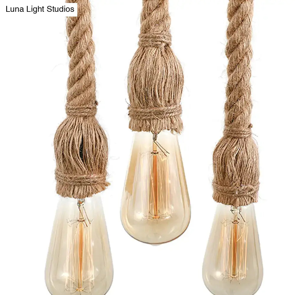 Three rustic rope pendant lights with adjustable rope exposed cords and light yellow glass edison bulbs for island use
