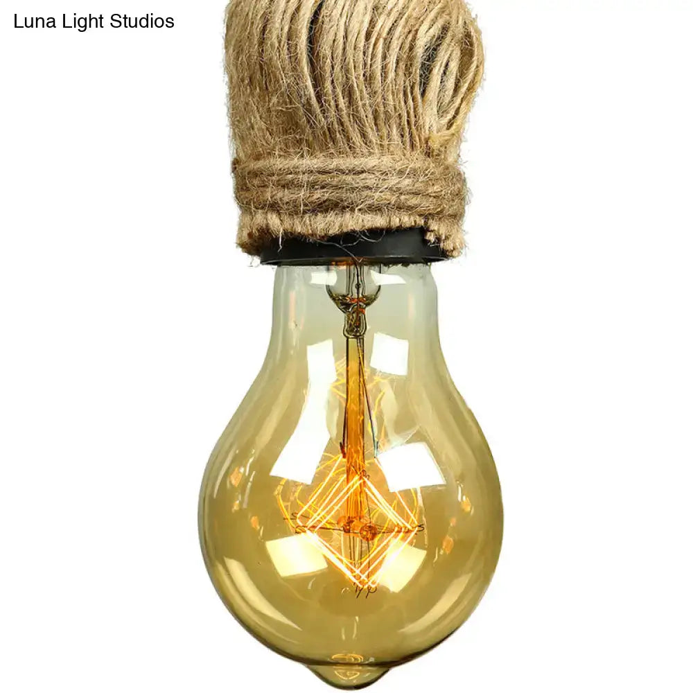 A warm-toned light yellow edison bulb with visible filament wrapped in natural jute rope for adjustable rope exposed island lighting