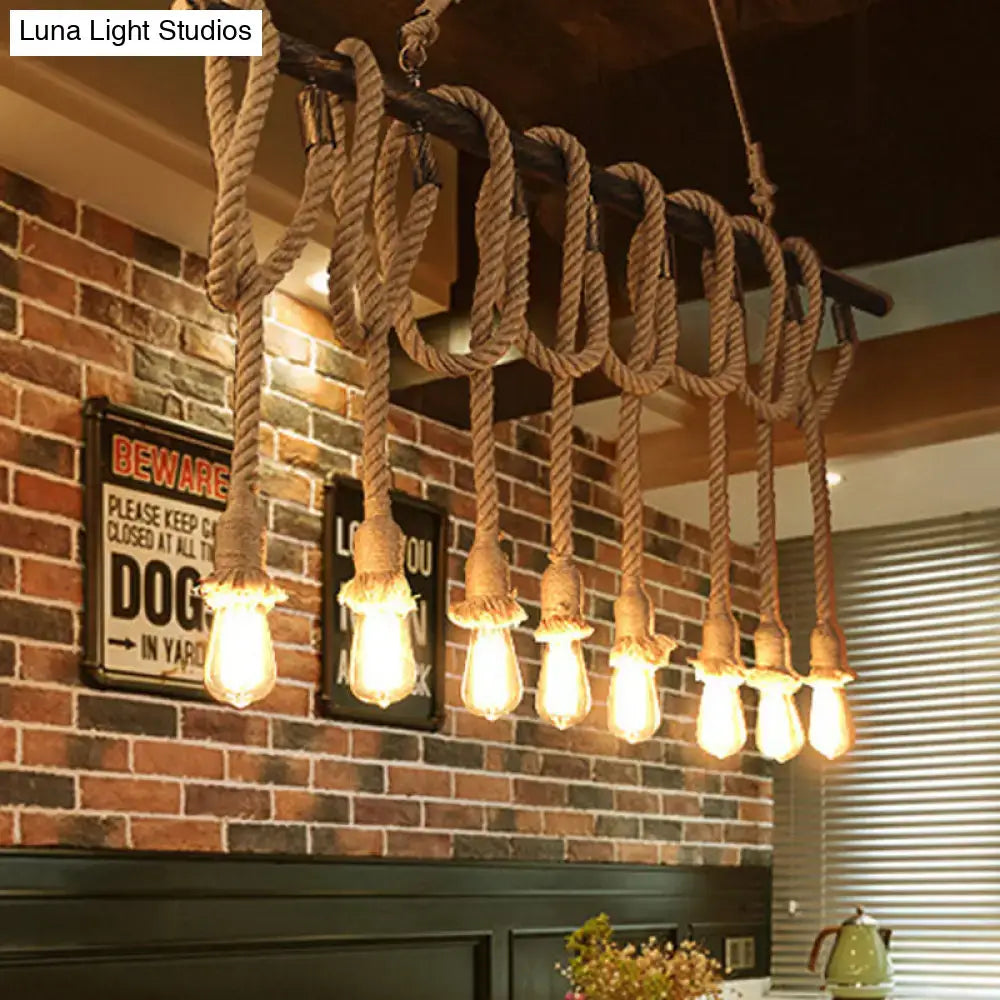 Decorbites adjustable rope exposed island light with thick beige rope and light yellow edison bulbs in retro industrial style