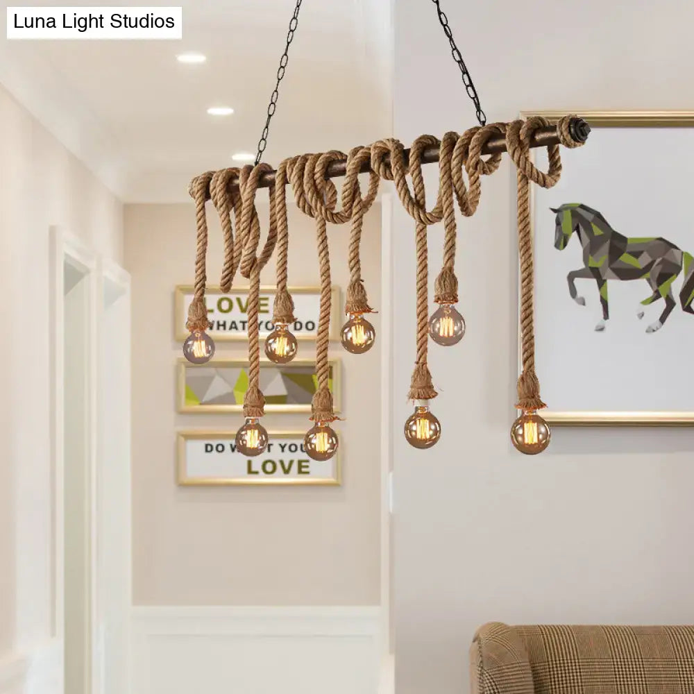 Decorbites adjustable rope exposed island light with rustic rope-wrapped wooden beam and light yellow filament bulbs
