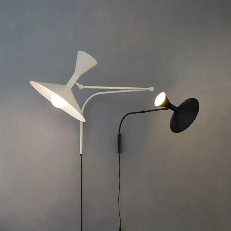 Modern industrial retro swing arm wall lamp with dual metallic arms and black and white shades for bedroom lighting