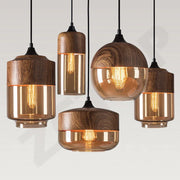Warm-toned amber glass led pendant light with natural wood accents and exposed filament bulbs for dining room light source