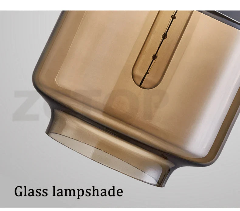 Amber-tinted glass led pendant light with sleek rectangular design and integrated filament bulb for dining room light source