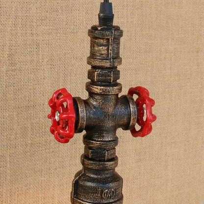 Industrial retro loft iron pipe pendant lamp with dark weathered metal body and bright red valve handles for dining room