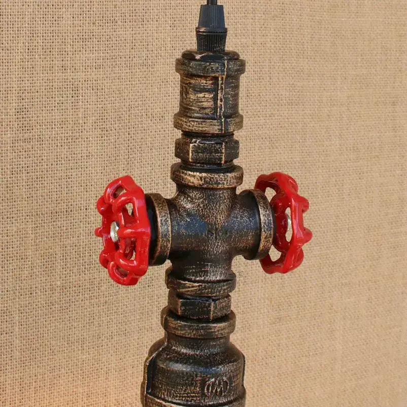 Industrial retro loft iron pipe pendant lamp with dark weathered metal body and bright red valve handles for dining room