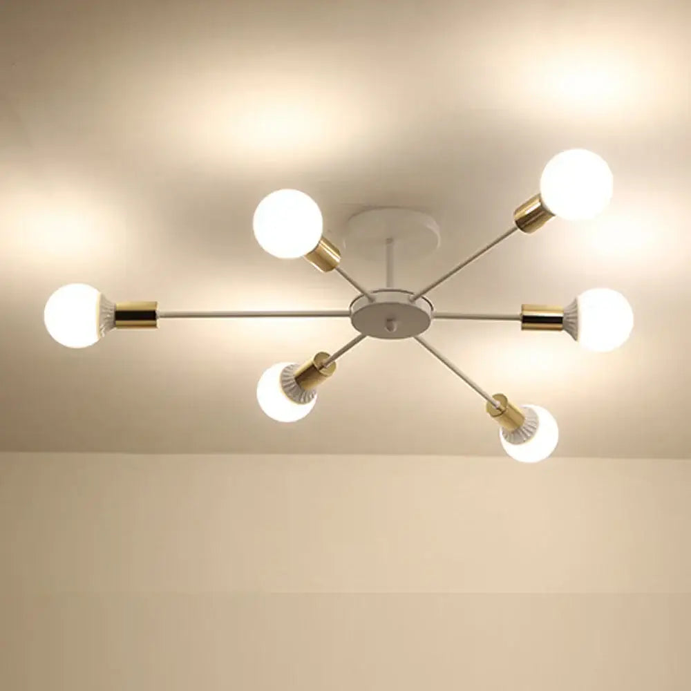 Modern industrial rod iron ceiling lamp with six spherical bulbs on slender metallic arms and gold-toned hardware