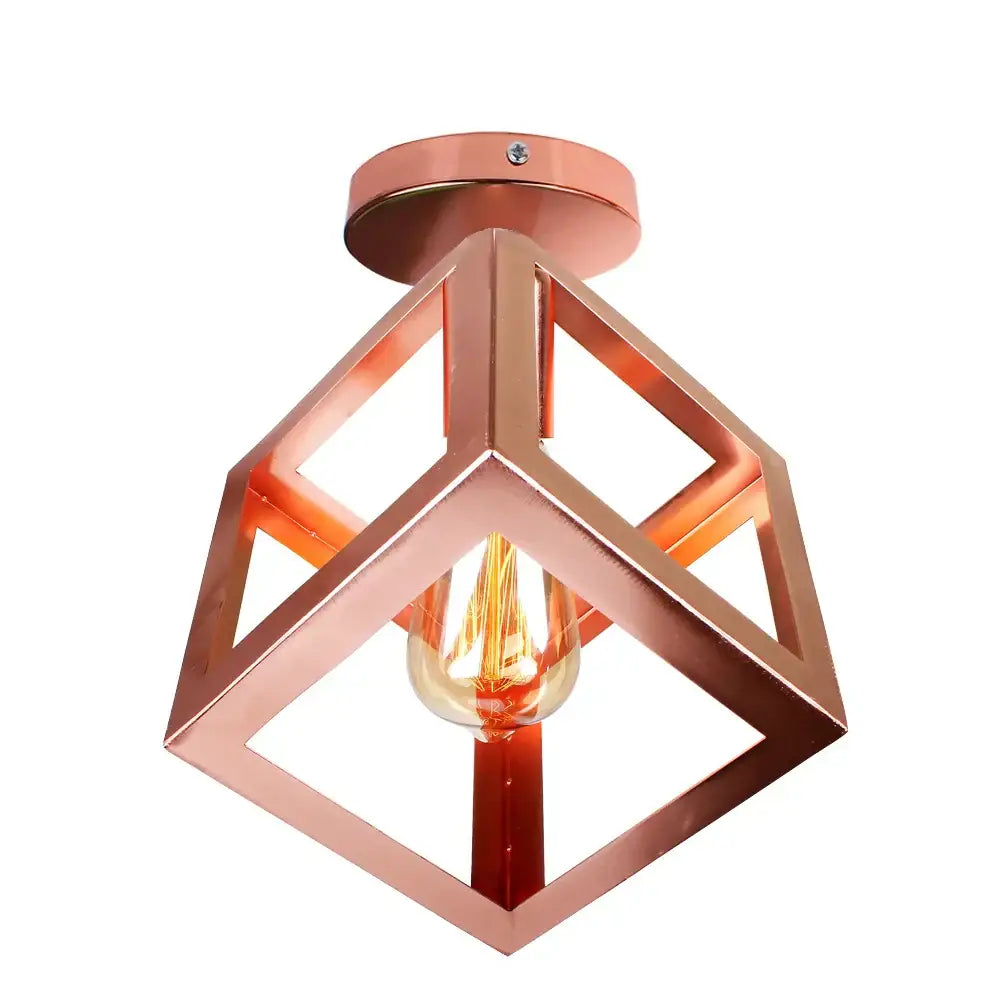 Copper-colored geometric ceiling light with visible filament bulb in industrial rose gold and brass finish for living room decorbites industrial ceiling light