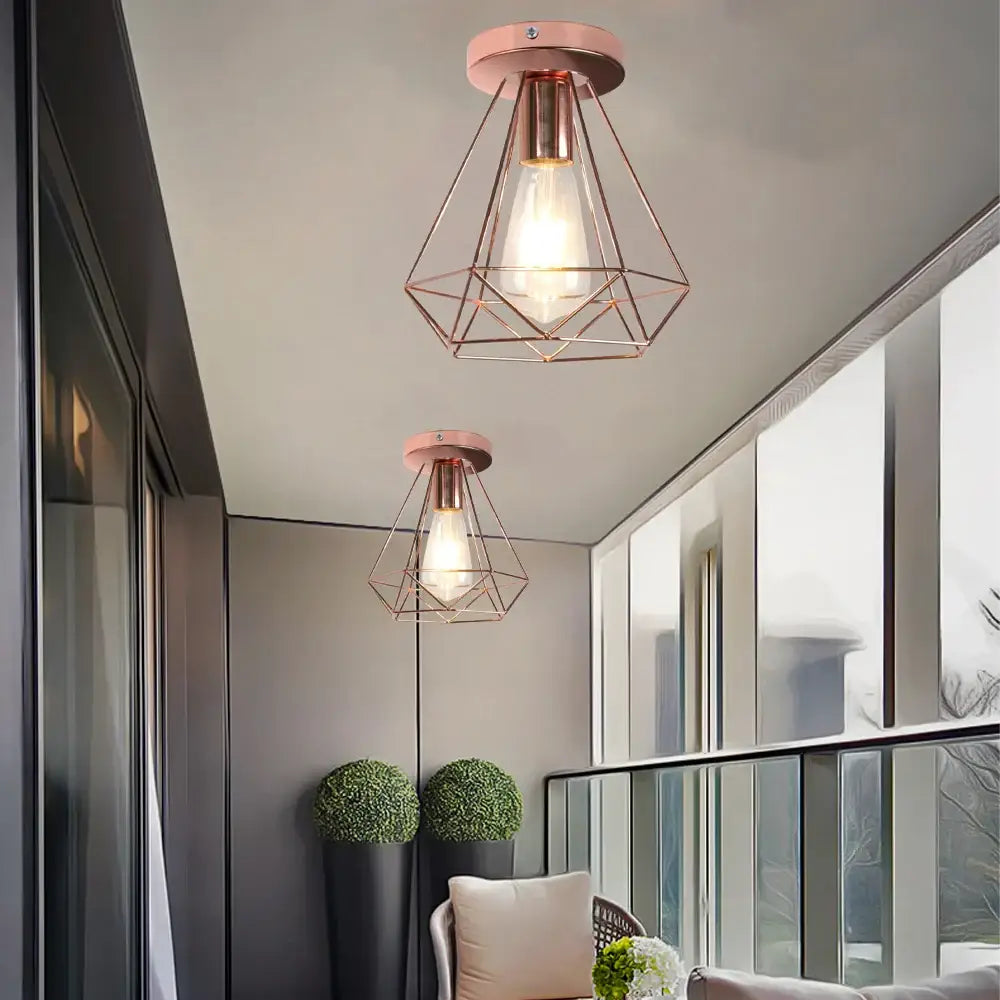 Industrial rose gold and brass ceiling light with geometric cage pendant lights and exposed filament bulbs for living room decorbites industrial ceiling light