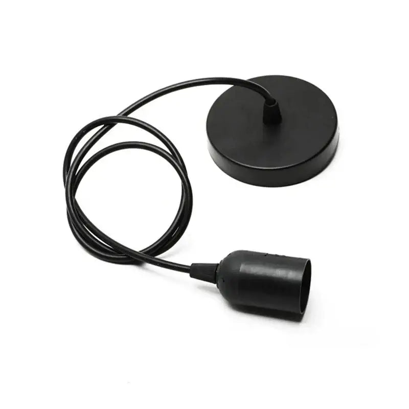 Black matte-finished led pendant lamp with circular ceiling mount and coiled cord for industrial dining room lighting