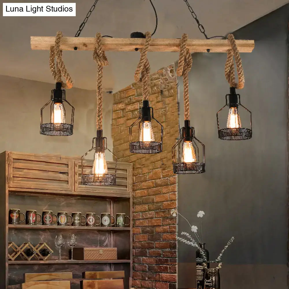 Industrial rustic hemp rope chandelier with weathered wooden beam, black metal cage lanterns, and exposed edison bulbs