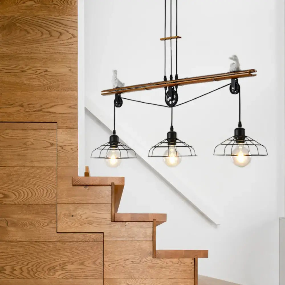 Decorbites rustic loft black metal pendant light with pulley design featuring three wire cage shades hanging from wooden beam